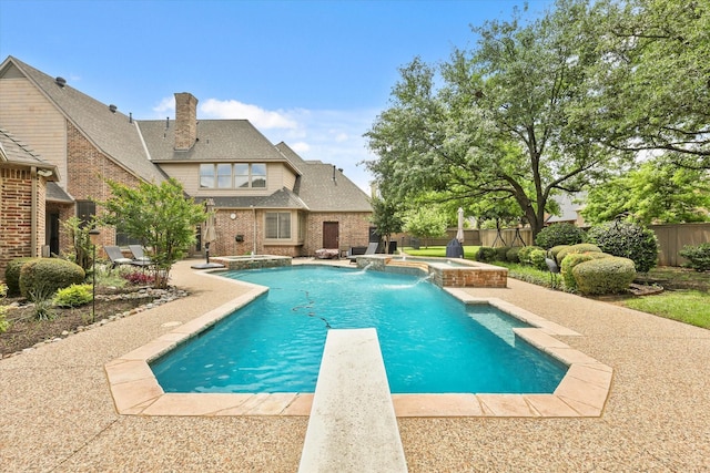 7208 Majestic Mnr, Colleyville, TX 76034 - view of swimming pool featuring a pool with connected hot tub, a patio area, and a fenced backyard