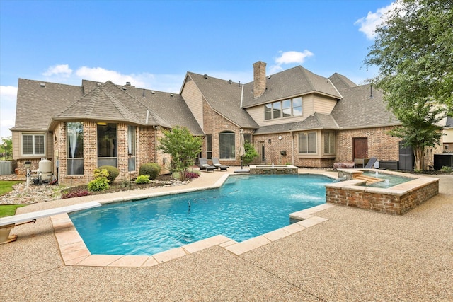 7208 Majestic Mnr, Colleyville, TX 76034 - view of swimming pool featuring a patio area, a pool with connected hot tub, central AC unit, and a diving board