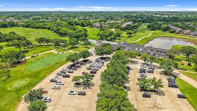 7208 Majestic Mnr, Colleyville, TX 76034 - drone / aerial view of a golf course, a large body of water, and a tree filled landscape