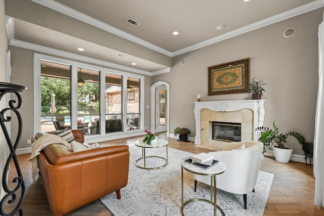 7208 Majestic Mnr, Colleyville, TX 76034 - living room with crown molding, wood finished floors, a premium fireplace, recessed lighting, and baseboards