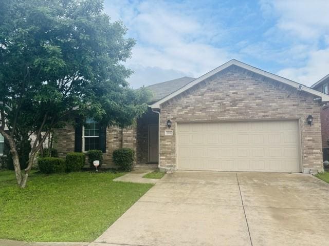 single story home featuring concrete driveway, an attached garage, brick siding, and a front yard