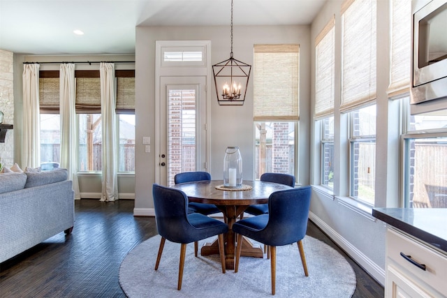 3609 Meridian Ave, Celina, TX 75009 - dining space featuring a chandelier, dark wood finished floors, and baseboards