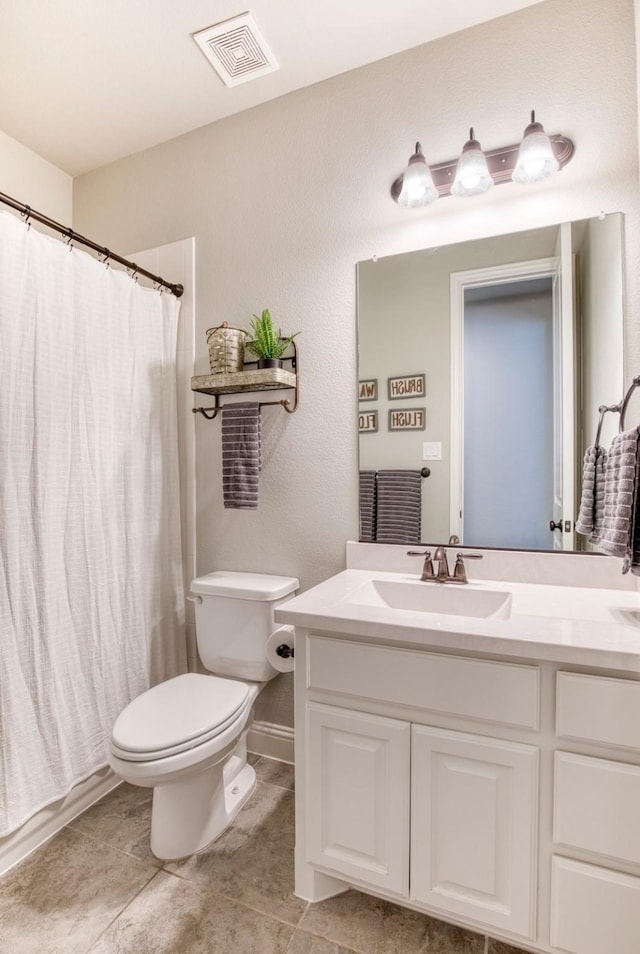 3609 Meridian Ave, Celina, TX 75009 - full bath featuring toilet, vanity, tile patterned floors, and a shower with shower curtain