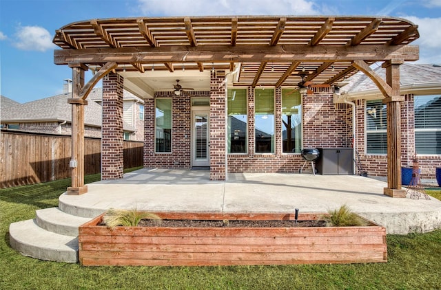 3609 Meridian Ave, Celina, TX 75009 - view of exterior entry featuring brick siding, fence, a pergola, and a ceiling fan