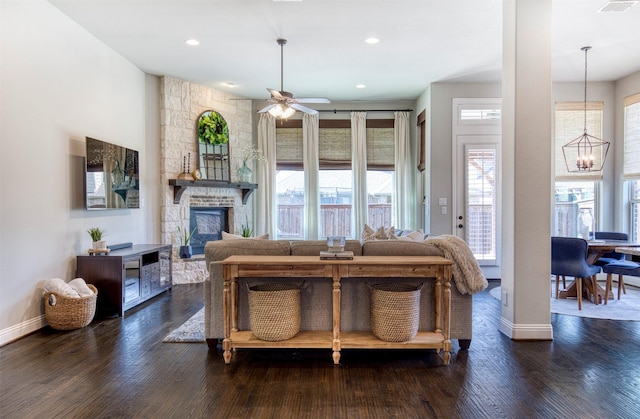 3609 Meridian Ave, Celina, TX 75009 - living area featuring a chandelier, ceiling fan, baseboards, a stone fireplace, and recessed lighting