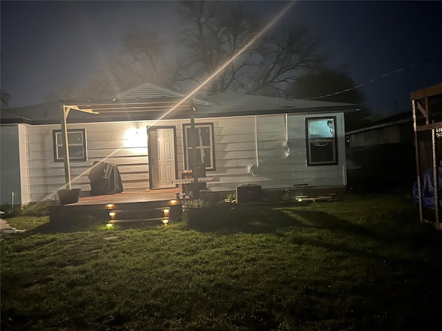 1220 Westmoreland Dr, Mckinney, TX 75069 - back of house at twilight with a lawn
