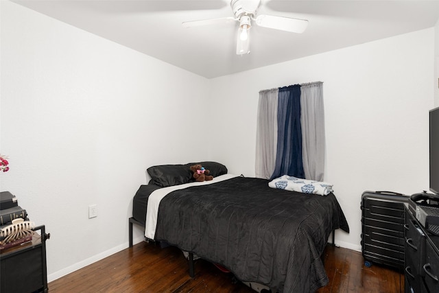 1220 Westmoreland Dr, Mckinney, TX 75069 - bedroom with baseboards, wood finished floors, and a ceiling fan