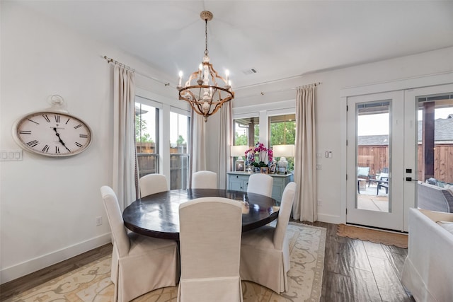 2218 Somercrest Pl, Midlothian, TX 76065 - dining room featuring a chandelier, healthy amount of natural light, light wood-style flooring, and baseboards