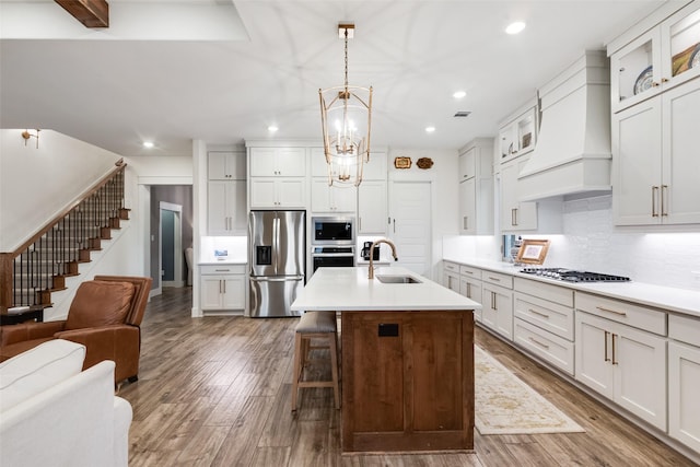 2218 Somercrest Pl, Midlothian, TX 76065 - kitchen with stainless steel appliances, a sink, custom range hood, open floor plan, and recessed lighting