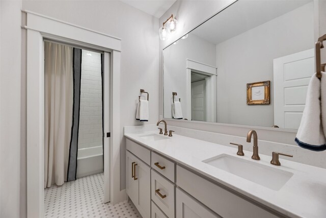 bathroom with tile patterned floors, double vanity, and shower / bathtub combination with curtain