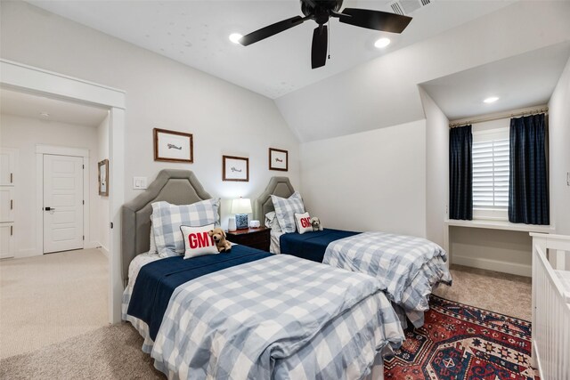bedroom featuring light colored carpet, lofted ceiling, ceiling fan, and baseboards
