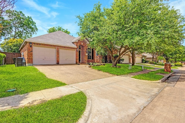 view of front facade with concrete driveway, an attached garage, brick siding, and a front yard