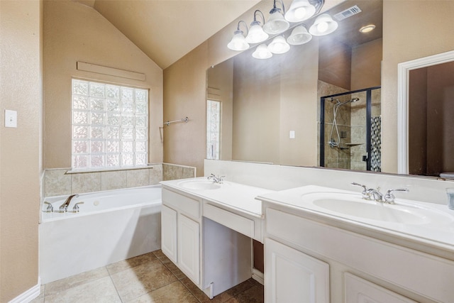 full bathroom with a stall shower, a garden tub, double vanity, tile patterned floors, and lofted ceiling