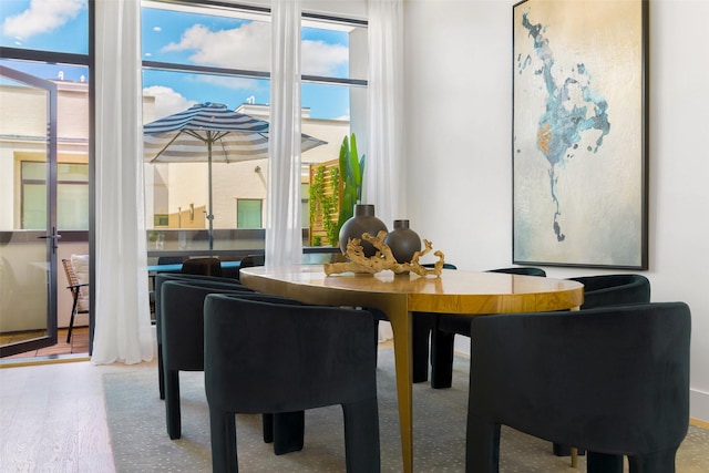 610 N Oak Cliff Blvd Unit 205, Dallas, TX 75208 - dining room with wood finished floors