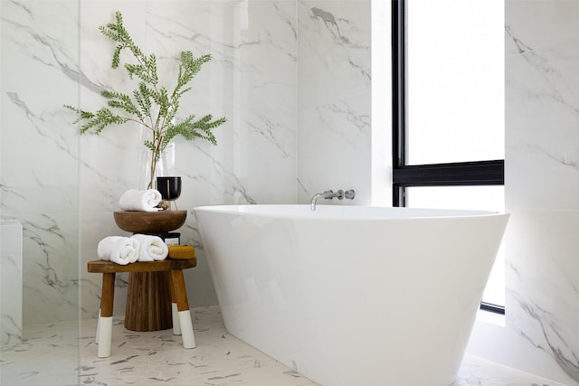 610 N Oak Cliff Blvd Unit 205, Dallas, TX 75208 - bathroom featuring stone wall and marble tiled flooring