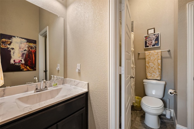1461 Lakeview Dr, Pelican Bay, TX 76020 - bathroom with toilet, vanity, and a textured wall
