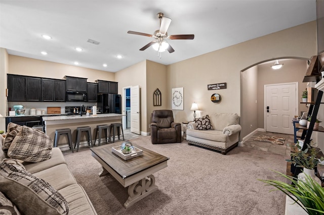 1461 Lakeview Dr, Pelican Bay, TX 76020 - living room featuring arched walkways, ceiling fan, light colored carpet, recessed lighting, and baseboards