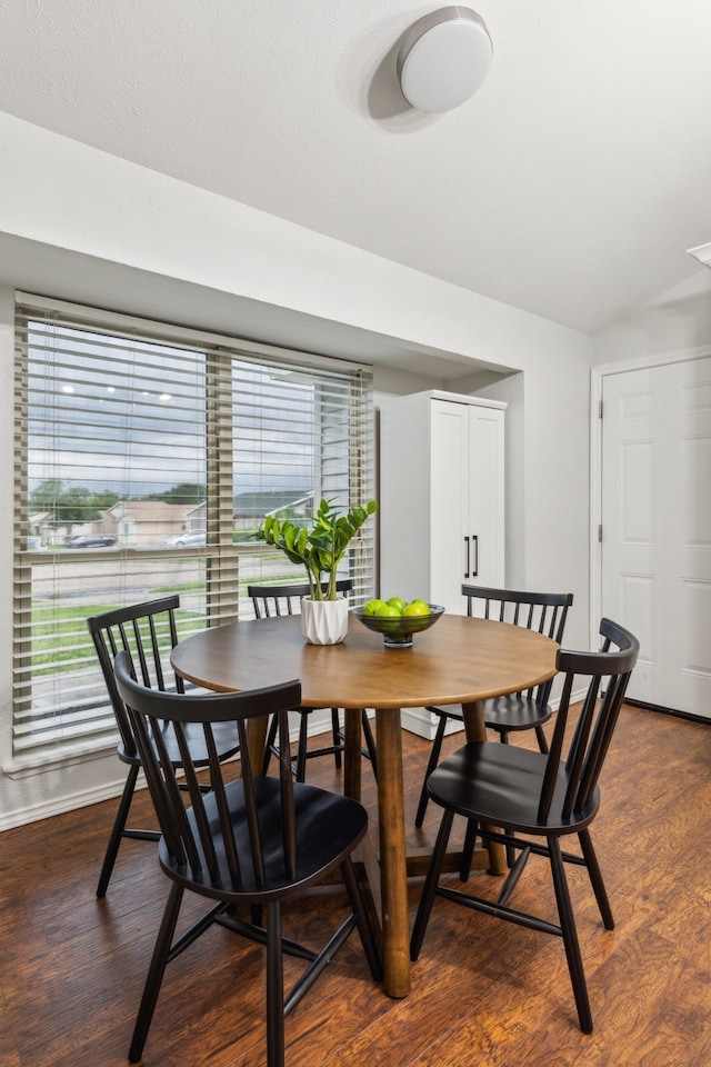 7116 Independence Dr, The Colony, TX 75056 - dining space with dark wood-type flooring, baseboards, healthy amount of natural light, and vaulted ceiling