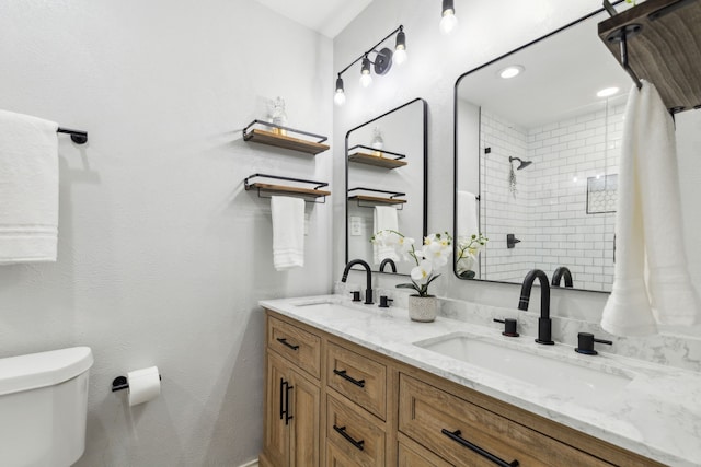 7116 Independence Dr, The Colony, TX 75056 - full bath featuring toilet, tiled shower, and double vanity