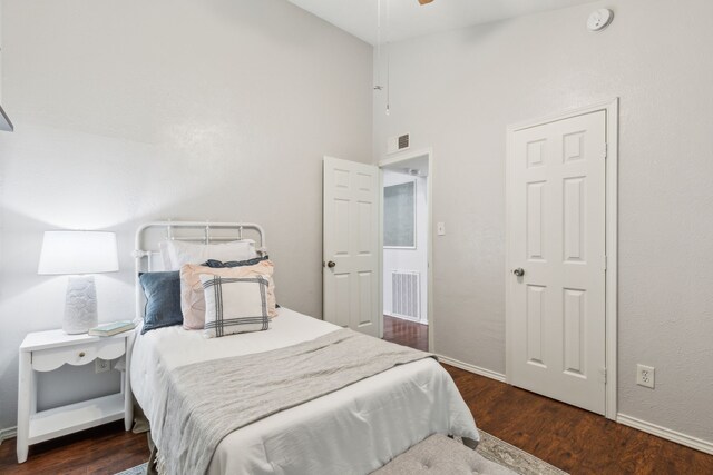 7116 Independence Dr, The Colony, TX 75056 - bedroom with high vaulted ceiling, wood finished floors, and baseboards