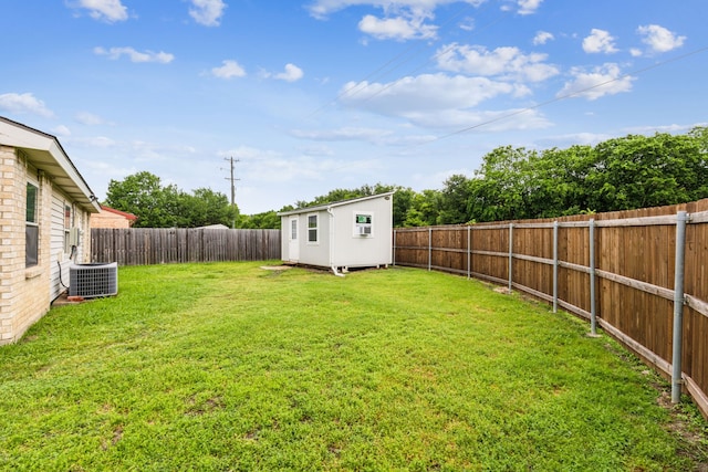 7116 Independence Dr, The Colony, TX 75056 - view of yard featuring central AC unit, an outbuilding, and a storage shed