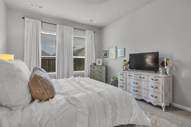 bedroom with carpet and baseboards