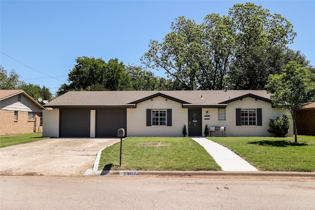 ranch-style home featuring a front yard and brick siding