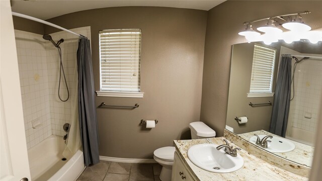 2308 16th St, Brownwood, TX 76801 - bathroom with tile patterned flooring, toilet, shower / bathtub combination with curtain, vanity, and baseboards