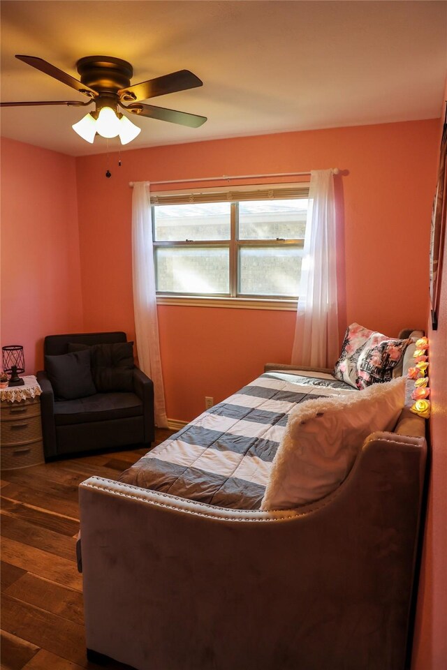 2308 16th St, Brownwood, TX 76801 - bedroom with dark wood-style floors and ceiling fan