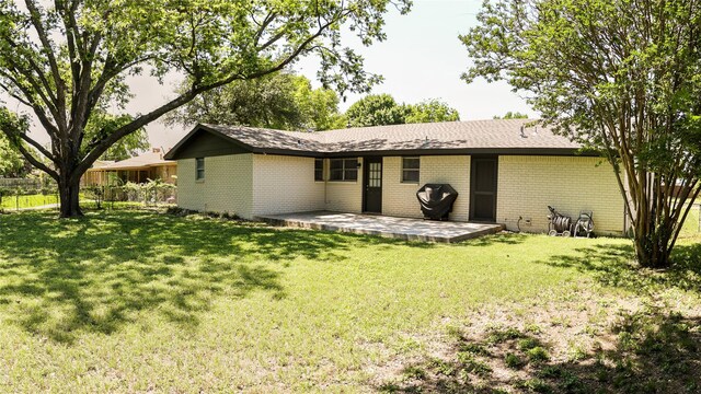 2308 16th St, Brownwood, TX 76801 - rear view of property with brick siding and a patio area