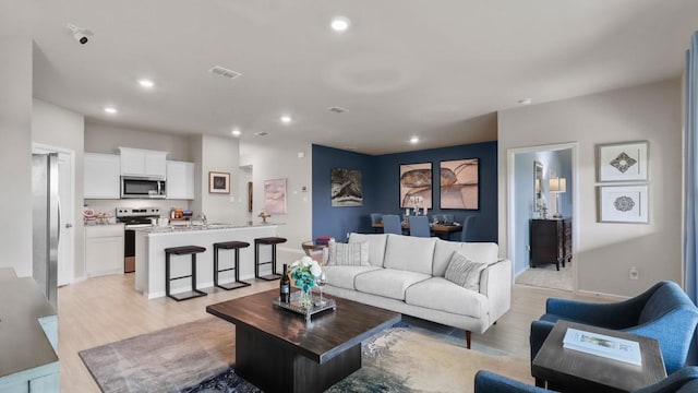 4109 Azam Ln, Fort Worth, TX 76036 - living room featuring light wood-style floors, recessed lighting, and baseboards