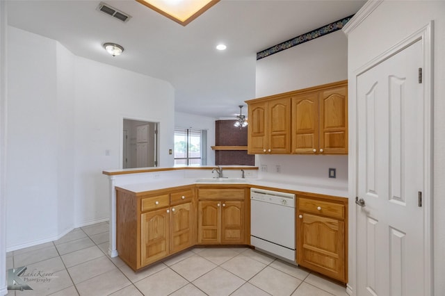 7118 Sable Cir, Abilene, TX 79606 - kitchen featuring dishwasher, a sink, a peninsula, light countertops, and light tile patterned flooring