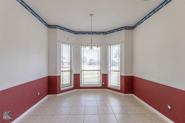 7118 Sable Cir, Abilene, TX 79606 - unfurnished dining area with a chandelier, healthy amount of natural light, baseboards, and tile patterned flooring