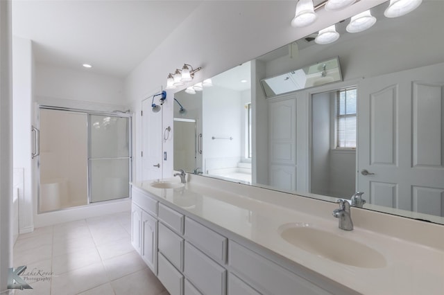 7118 Sable Cir, Abilene, TX 79606 - full bathroom featuring a stall shower, tile patterned flooring, double vanity, and recessed lighting