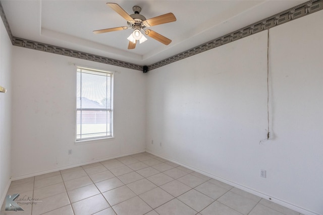 7118 Sable Cir, Abilene, TX 79606 - empty room featuring a ceiling fan, a tray ceiling, and baseboards