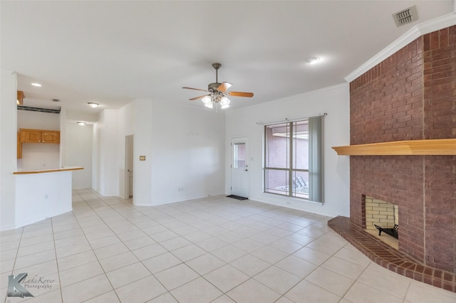 7118 Sable Cir, Abilene, TX 79606 - unfurnished living room featuring light tile patterned flooring, ceiling fan, a fireplace, baseboards, and ornamental molding