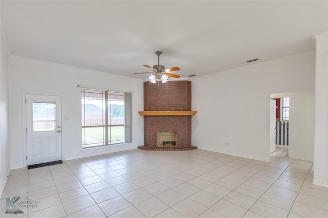 7118 Sable Cir, Abilene, TX 79606 - unfurnished living room featuring ornamental molding, a ceiling fan, light tile patterned floors, and a brick fireplace