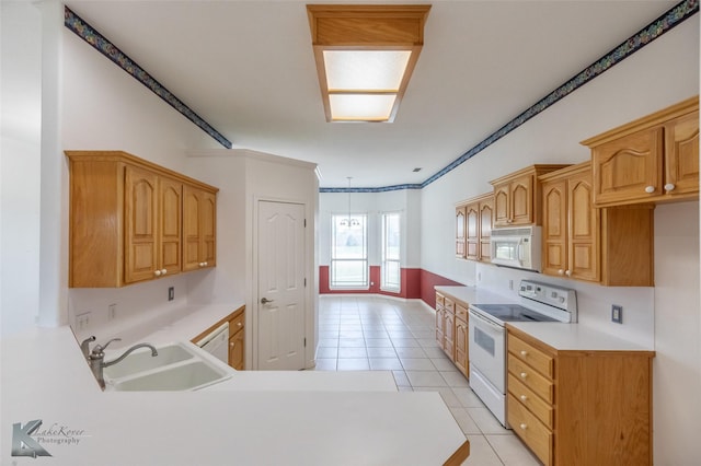 7118 Sable Cir, Abilene, TX 79606 - kitchen featuring white appliances, a sink, light tile patterned floors, light countertops, and ornamental molding