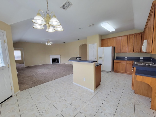 1006 Redwood Trl, Rockwall, TX 75087 - kitchen with white appliances, vaulted ceiling, dark countertops, a chandelier, and arched walkways
