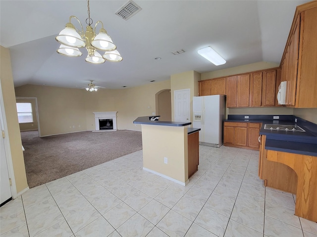 1006 Redwood Trl, Rockwall, TX 75087 - kitchen with white appliances, dark countertops, a chandelier, ceiling fan, and arched walkways