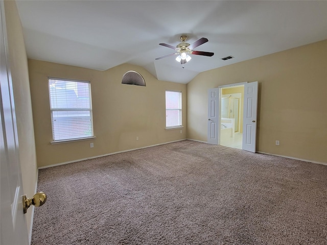 1006 Redwood Trl, Rockwall, TX 75087 - spare room featuring a ceiling fan, carpet floors, vaulted ceiling, and baseboards