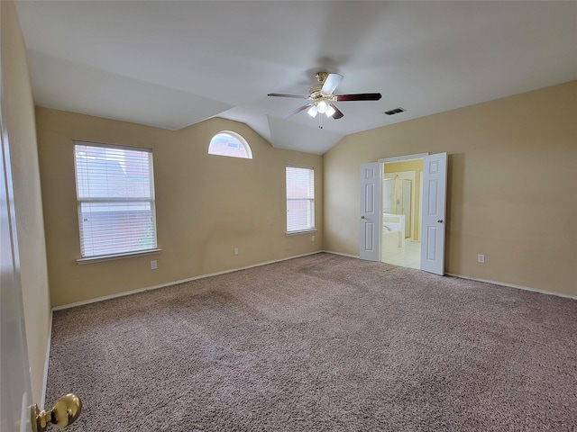 1006 Redwood Trl, Rockwall, TX 75087 - unfurnished bedroom with lofted ceiling, carpet floors, baseboards, a ceiling fan, and ensuite bathroom