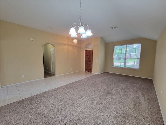 1006 Redwood Trl, Rockwall, TX 75087 - carpeted spare room with arched walkways, a chandelier, baseboards, and tile patterned floors