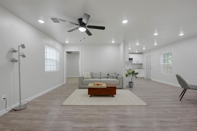 3030 Utah Ave, Dallas, TX 75216 - living room with ceiling fan, baseboards, light wood-style flooring, healthy amount of natural light, and recessed lighting