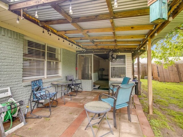 view of patio featuring fence