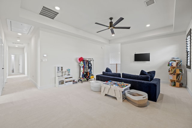 1914 Mann Pkwy, Celina, TX 75009 - living room with attic access, carpet flooring, a ceiling fan, a raised ceiling, and baseboards