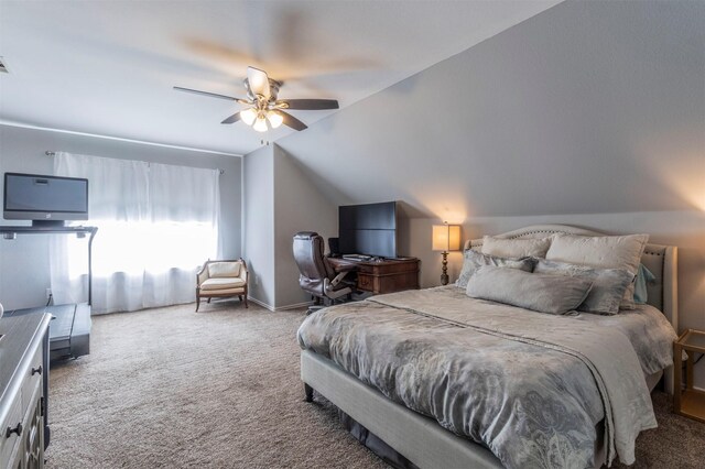 bedroom with carpet floors, lofted ceiling, ceiling fan, and baseboards