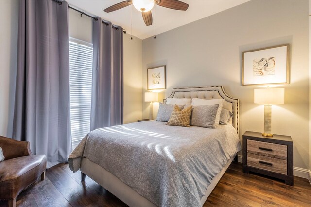 bedroom with wood finished floors, baseboards, and ceiling fan