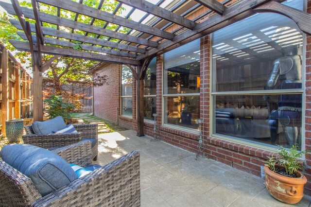 view of patio / terrace with fence and a pergola
