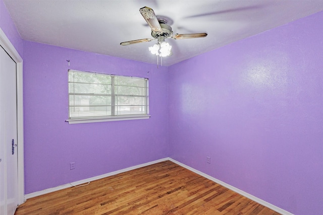 1809 Stevens St, Bridgeport, TX 76426 - unfurnished bedroom with baseboards, wood finished floors, a closet, and a ceiling fan
